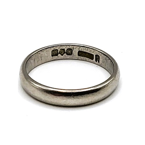 239 - A fully hallmarked platinum ring, size K1/2, 3.9gms, a gold wedding band with faint scroll work insc... 