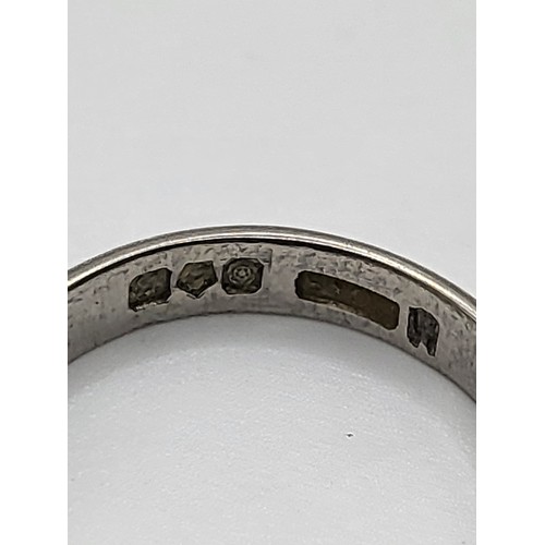 239 - A fully hallmarked platinum ring, size K1/2, 3.9gms, a gold wedding band with faint scroll work insc... 