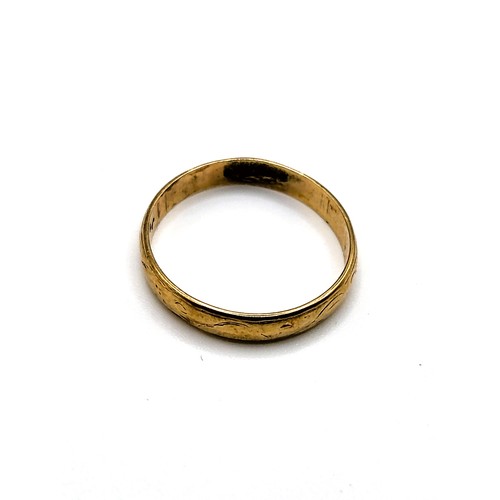 239 - A fully hallmarked platinum ring, size K1/2, 3.9gms, a gold wedding band with faint scroll work insc... 