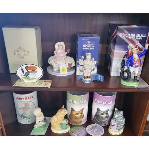 158 - Royal Doulton and Wade figures including Michelin and Whiskas Cat, five with boxes and an empty Coal... 