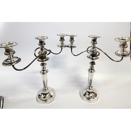 197 - A pair of candelabra and a collection of silver plate