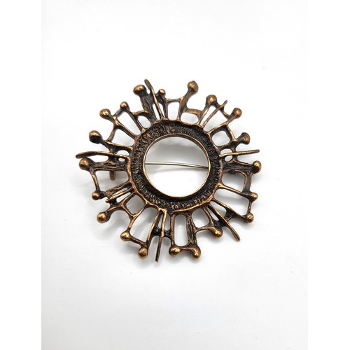 248 - An Uni David-Andersen bronze designer brooch in the shape of a snowflake 5cm, 10.7gms