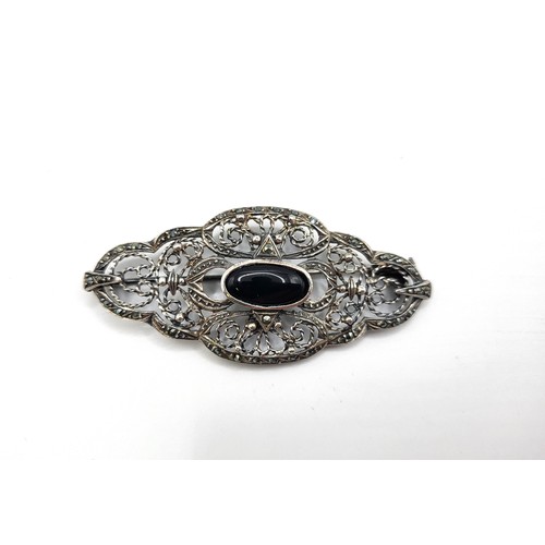 250 - AHS Norwegian 925 silver ornate filigree brooch set with marcasite and with a central oval black gla... 