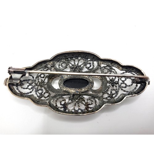 250 - AHS Norwegian 925 silver ornate filigree brooch set with marcasite and with a central oval black gla... 