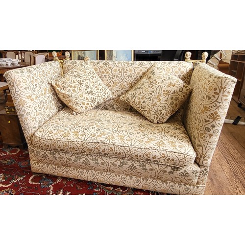 1 - A vintage two seater Knole sofa in cream upholstery, with two matching cushions and on casters. H 10... 