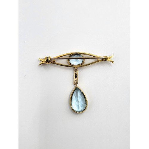 257 - An aquamarine brooch and a pear cut and an oval cut plus a small pearl set in 'gold' no hallmark 4.5... 