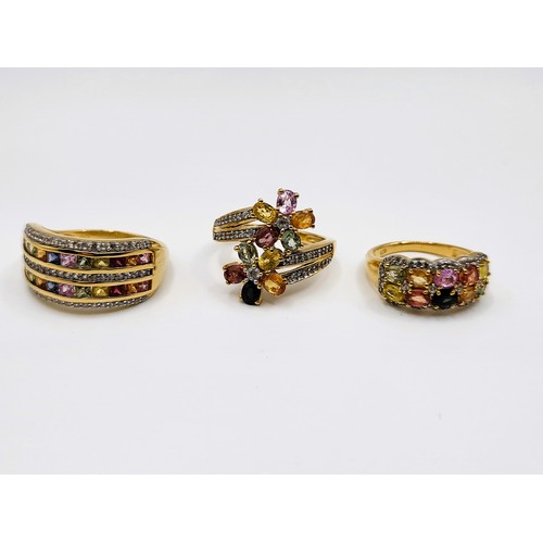 258 - Three gold on silver multi-gem set rings including a double channel set, princess cut, size S 5.2gms... 