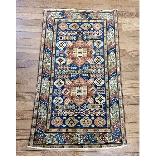 55 - Red and blue patterned handmade Turkish rug with original receipt. 155cm x 90cm.