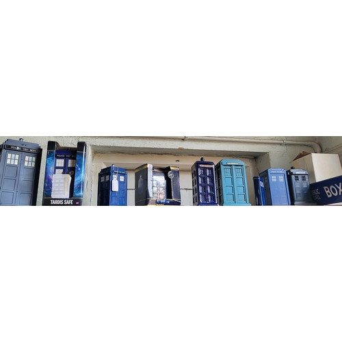 114 - Nine plastic tinplate and ceramic Tardis Police Telephone Boxes 12cm to 25cm (9)