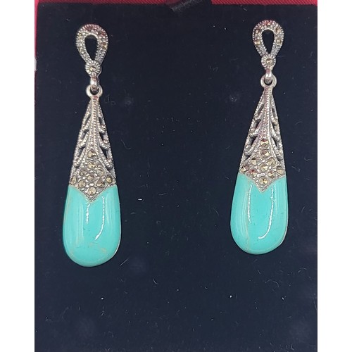 265 - A pair of silver marcasite and turquoise Art Deco style earrings. 4.7cm   7.9gms.