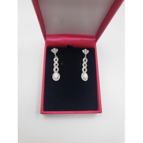 267 - A pair of silver  cubic zirconia and man-made opal panelled drop earrings 5.2gms.