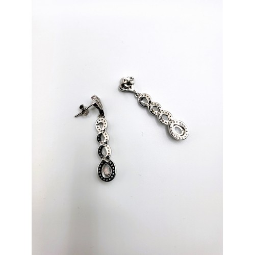 267 - A pair of silver  cubic zirconia and man-made opal panelled drop earrings 5.2gms.