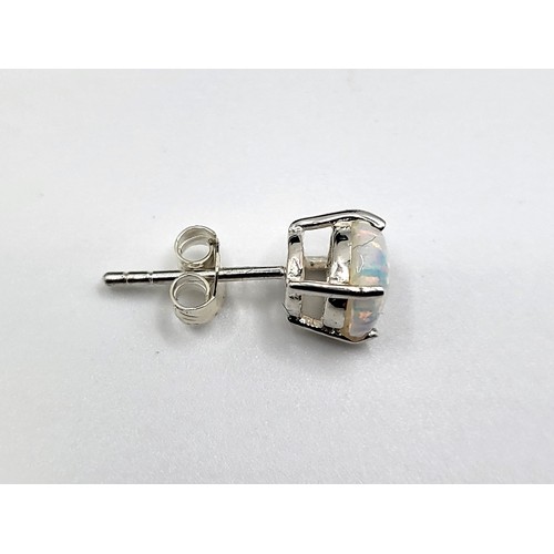 273 - A pair of silver and cubic zirconia and man-made opals stud earrings on silver posts 1.5cm x 1.1cm  ... 