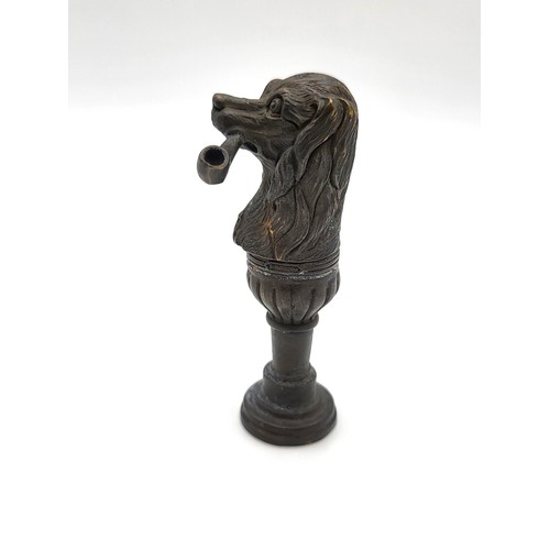 93 - A bronze document seal in the form of a dog with a pipe. 6.5cm 32.1gms