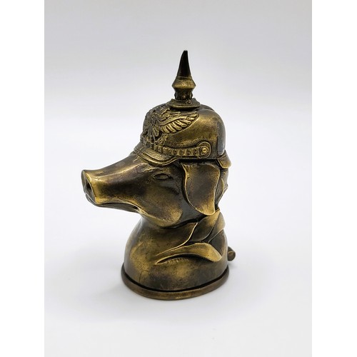 94 - A brass vesta case in the form of a pig in a German Pickelhaube 7cm x 3.5cm. 72gms. 1915 Ypres trenc... 