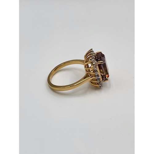 279 - An Ametrine ring emerald cut stone surrounded by round brilliant cut tourmaline on a gold coloured p... 