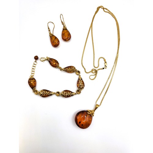 283 - TGGC parure amber set including pear shaped amber  pendant 37cm chain 11.4gms, teardrop French hoop ... 