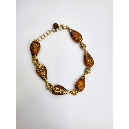 283 - TGGC parure amber set including pear shaped amber  pendant 37cm chain 11.4gms, teardrop French hoop ... 