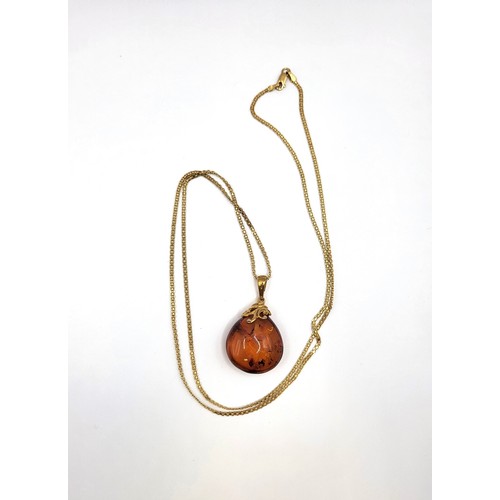 283 - TGGC parure amber set including pear shaped amber  pendant 37cm chain 11.4gms, teardrop French hoop ... 