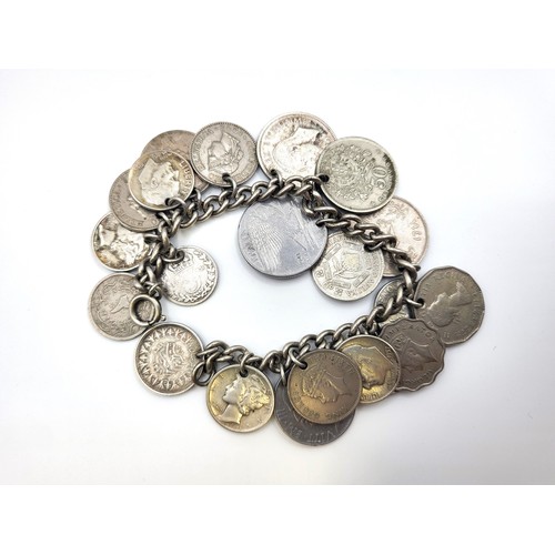 284 - A world coin charm bracelet including coins from Canada, South Africa, UK (Victorian silver threepen... 