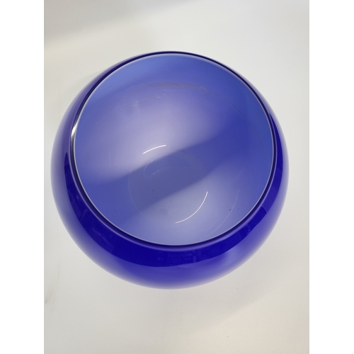 150 - A blue overlay glass spherical bowl 25cm diameter 21cm high.