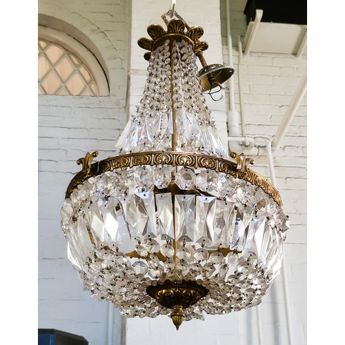 11 - A 'statement' Italian lead crystal three bulb chandelier 62cm x 38cm. A number of the droplets are a... 