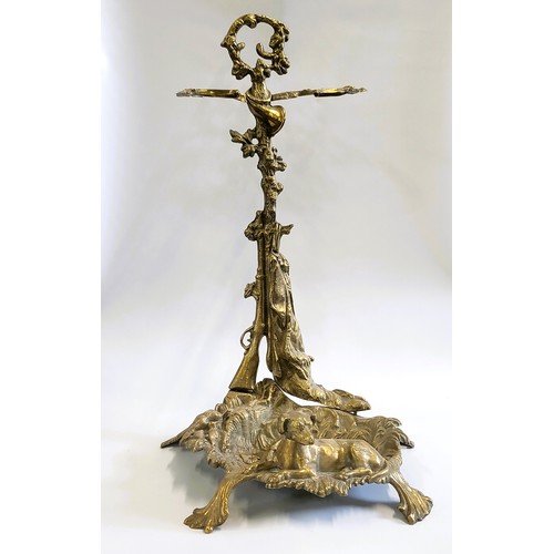 117 - A brass umbrella stand and two brass candlesticks