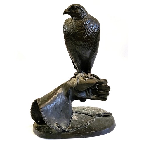 119 - Jeanne Rynhart (1946-2020) bronze resin Falcon on a glove sculpture. Signed  E/250. Size 63cm x 33cm... 