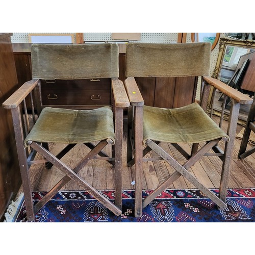 21 - Two folding directors chairs with olive/brown velvet back and seat.