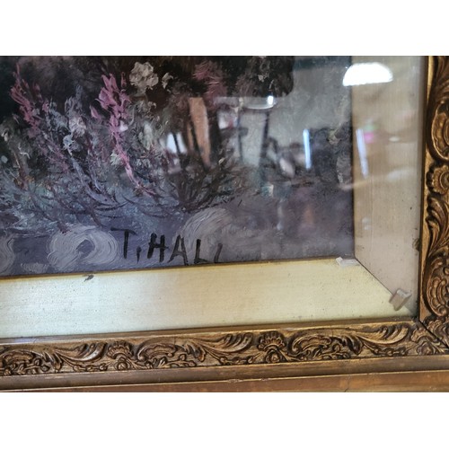 100 - Two scenes in oil by artist T. Hall depicting countryside scenes, presented in ornate gilded frame a... 