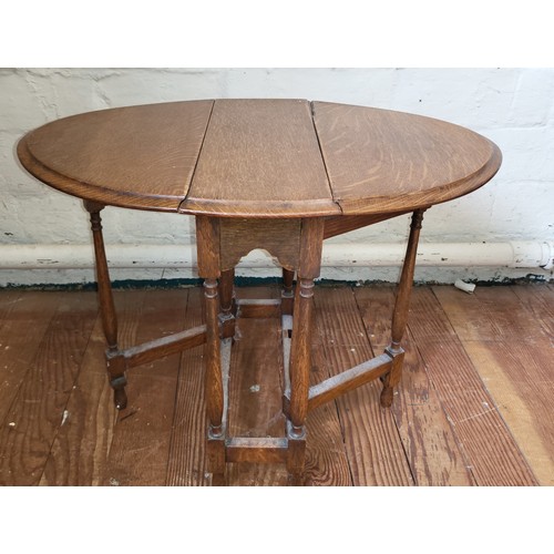 29 - A miniature oak gateleg table 47cm x 14cm x 40cm (extending leaves 23cm each)