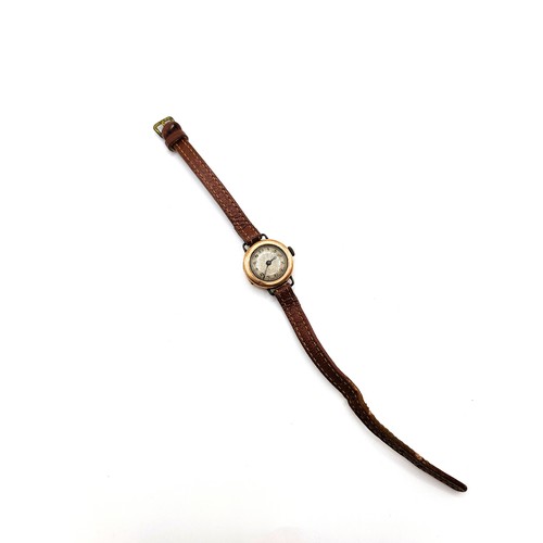 430 - A ladies 9ct rose gold watch (no makers mark) on a leather strap. Circa 1920/30.