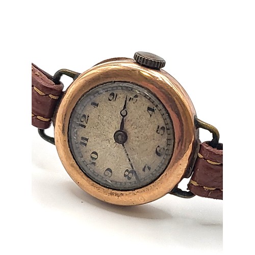 430 - A ladies 9ct rose gold watch (no makers mark) on a leather strap. Circa 1920/30.