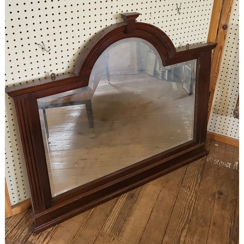 35 - An Art Deco mahogany wall mirror. 90cm x 108 cm.