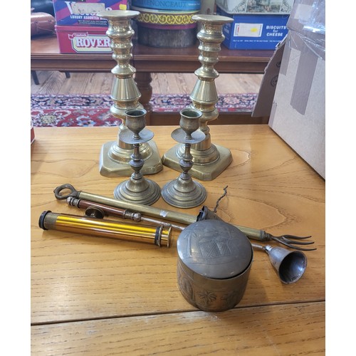 125 - Four brass candlesticks and other brassware