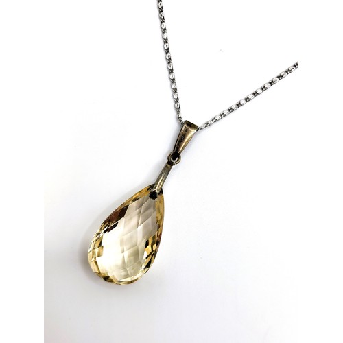 389 - A +25ct citrine pendeloque cut pendant (25mm x 15mm) on a chain 68cm 8.5gms all in.