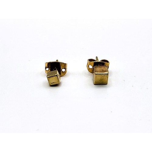 390 - Mismatched cube studs yellow gold. 0.5gms