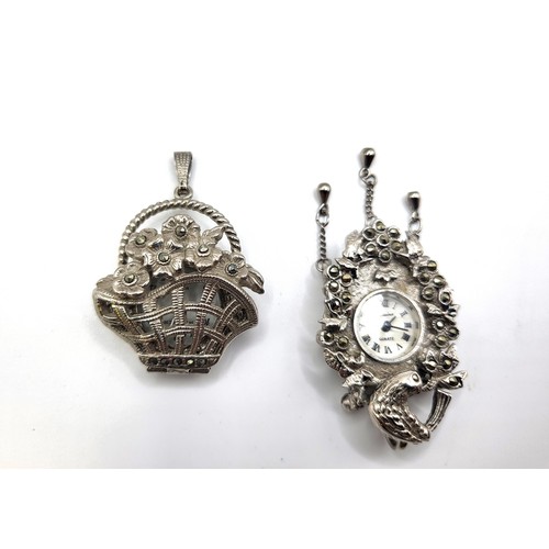 396 - Two modern ladies timepieces: one a flower basket design pendant set in marcasite (4cm closed), the ... 