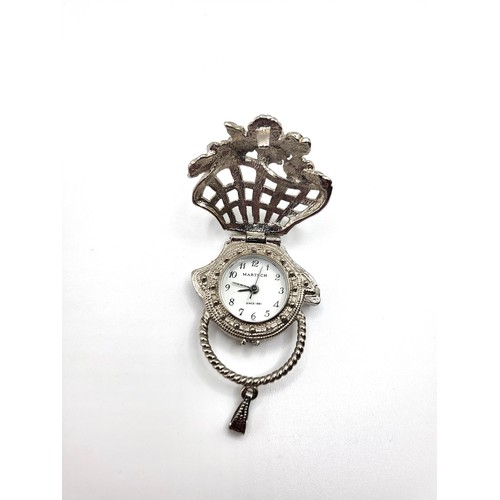 396 - Two modern ladies timepieces: one a flower basket design pendant set in marcasite (4cm closed), the ... 