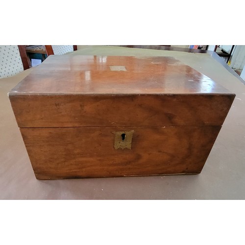 37 - A mahogany writing slope with presentation label of 1896. 14cm x 26cm x 22cm