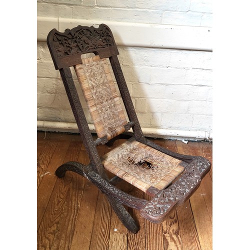 41 - A Mongolian folding chair with rattan seating (in need of restoration) 84cm x 51cm x 84cm