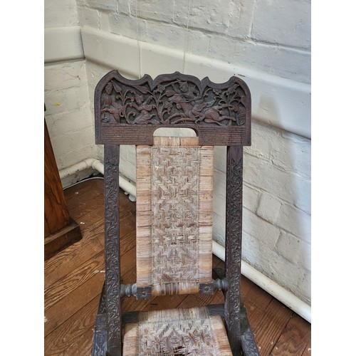 41 - A Mongolian folding chair with rattan seating (in need of restoration) 84cm x 51cm x 84cm