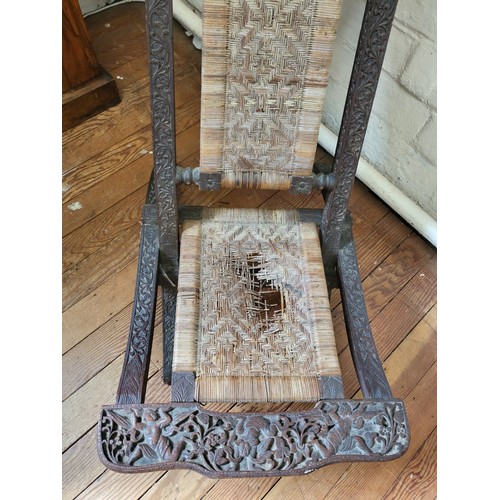 41 - A Mongolian folding chair with rattan seating (in need of restoration) 84cm x 51cm x 84cm