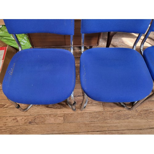 44 - Four 1970 chrome dining chairs with blue cloth covers. Some parcel tape residue on seats.