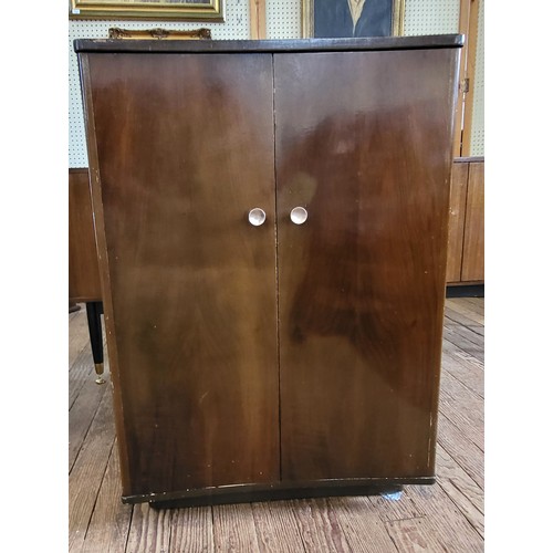 45 - A 1930's bow front music cabinet 116cm x 57cm x 31cm.