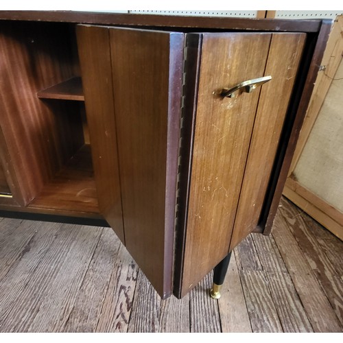 46 - A G-Plan Librenza tola wood sideboard, with three drawers down the middle (top one has dividers) and... 