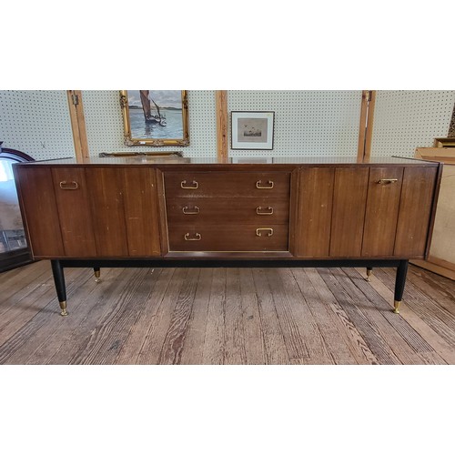 46 - A G-Plan Librenza tola wood sideboard, with three drawers down the middle (top one has dividers) and... 