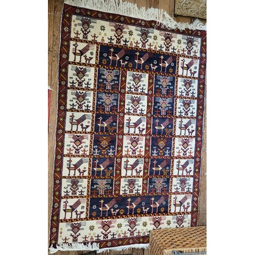 81 - A red, blue and cream rug, 175cm x 110cm