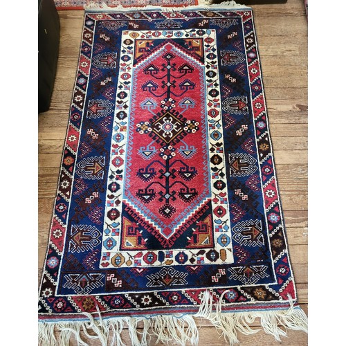 82 - A red and blue rug 200cm x 120