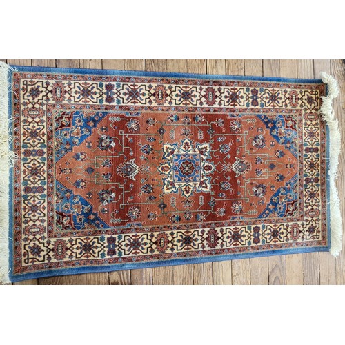 87 - A pure wool rug 140cm x 82cm